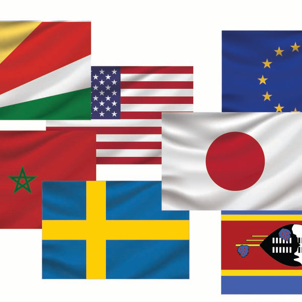 A collection of nine Cover-Alls Flags of the World decals from various countries, displayed overlapping each other on a white background.