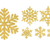 Six gold glitter snowflake ornaments of varying designs are displayed on a white background, alongside delicate Snowflake Decals by Cover-Alls.