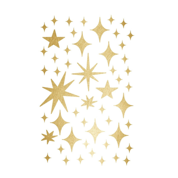A collection of Cover-Alls Gold Twinkly Stars in various sizes and styles arranged in a magical scene on a white background.