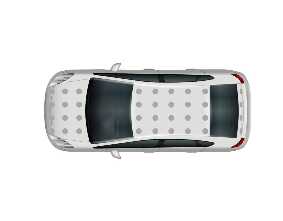 Top view of a white car with a black roof and Cover-Alls Dot Decals, parked, showing no visible surroundings.