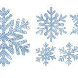Image of six blue, glittery snowflakes of various sizes and designs on a white background, accented with bluish-silver Snowflake Decals by Cover-Alls.