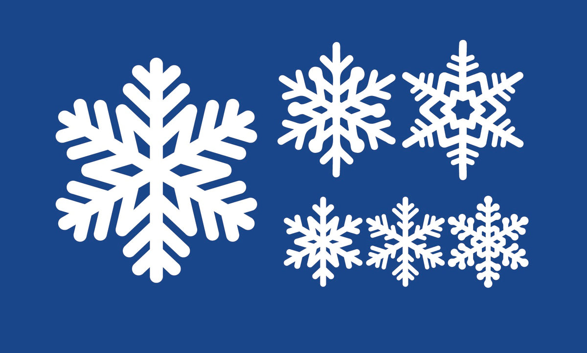 Five Cover-Alls Snowflake Decals of different shapes and sizes decorate a blue background, creating a wintry scene.