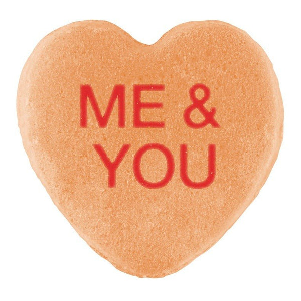 Heart-shaped Candy Hearts with the words "me & you" written in red icing, isolated on a white background for Valentine's Day by Cover-Alls.