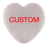 A heart-shaped object with a textured surface, featuring the word 
