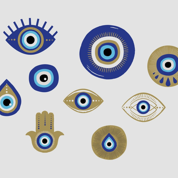 Graphic collection of various stylized eyes and symbols, including the protective emblem and hamsa, in blue, white, and gold tones by Cover-Alls Evil Eye Decals.