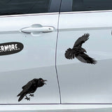 Car door adorned with various raven and skull stickers; one life-sized Cover-Alls skull decal contains the word 