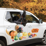 A white SUV with a person's legs and Cover-Alls Thanksgiving Cornucopia Decals sticking out of the window, parked beside trees with autumn leaves.