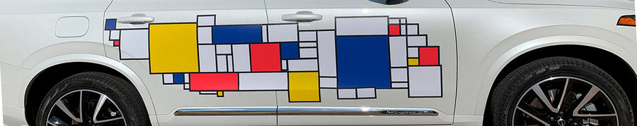 A white suv with a colorful design on the side.