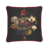 The Dark Romance Silk Pillow Cushion by Contrado features a skull, green snake, and vibrant flowers on black silk with red trim. Handmade to order, this exclusive piece adds a bold touch to your home decor.