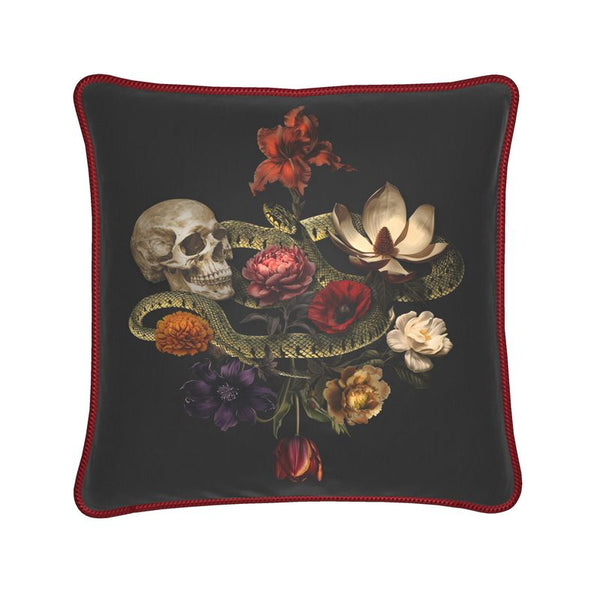 The Dark Romance Silk Pillow Cushion by Contrado features a skull, green snake, and vibrant flowers on black silk with red trim. Handmade to order, this exclusive piece adds a bold touch to your home decor.