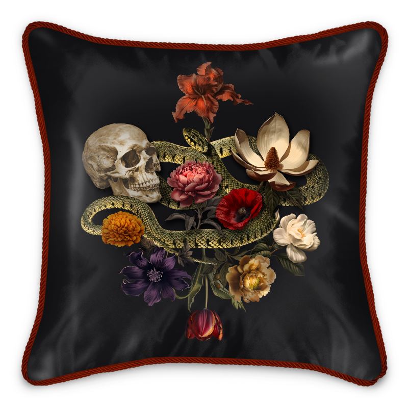 The Dark Romance Silk Pillow Cushion by Contrado boasts luxurious padding with a sleek black surface, embellished with red piping and a striking decorative design featuring a skull, a green snake, and an array of colorful flowers.