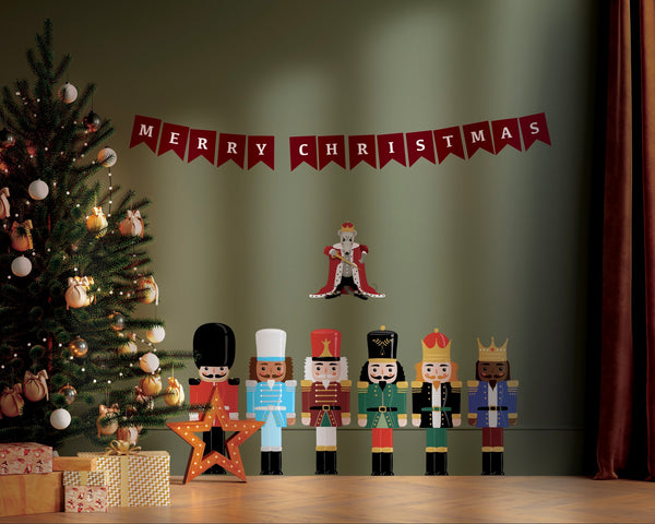 A christmas tree with CoverAlls Nutcracker Decals in front of it.