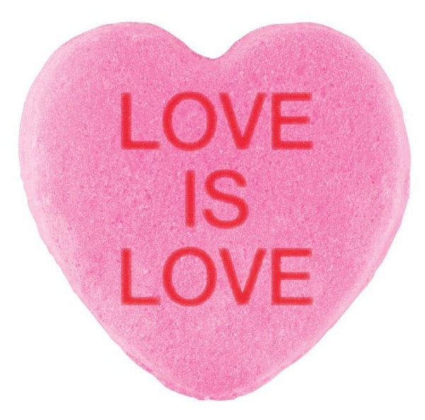 A three-dimensional pink heart-shaped Candy Hearts for Pride with the phrase "love is love" embossed in red letters by Cover-Alls.