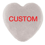 Heart-shaped object with a textured surface and the word 