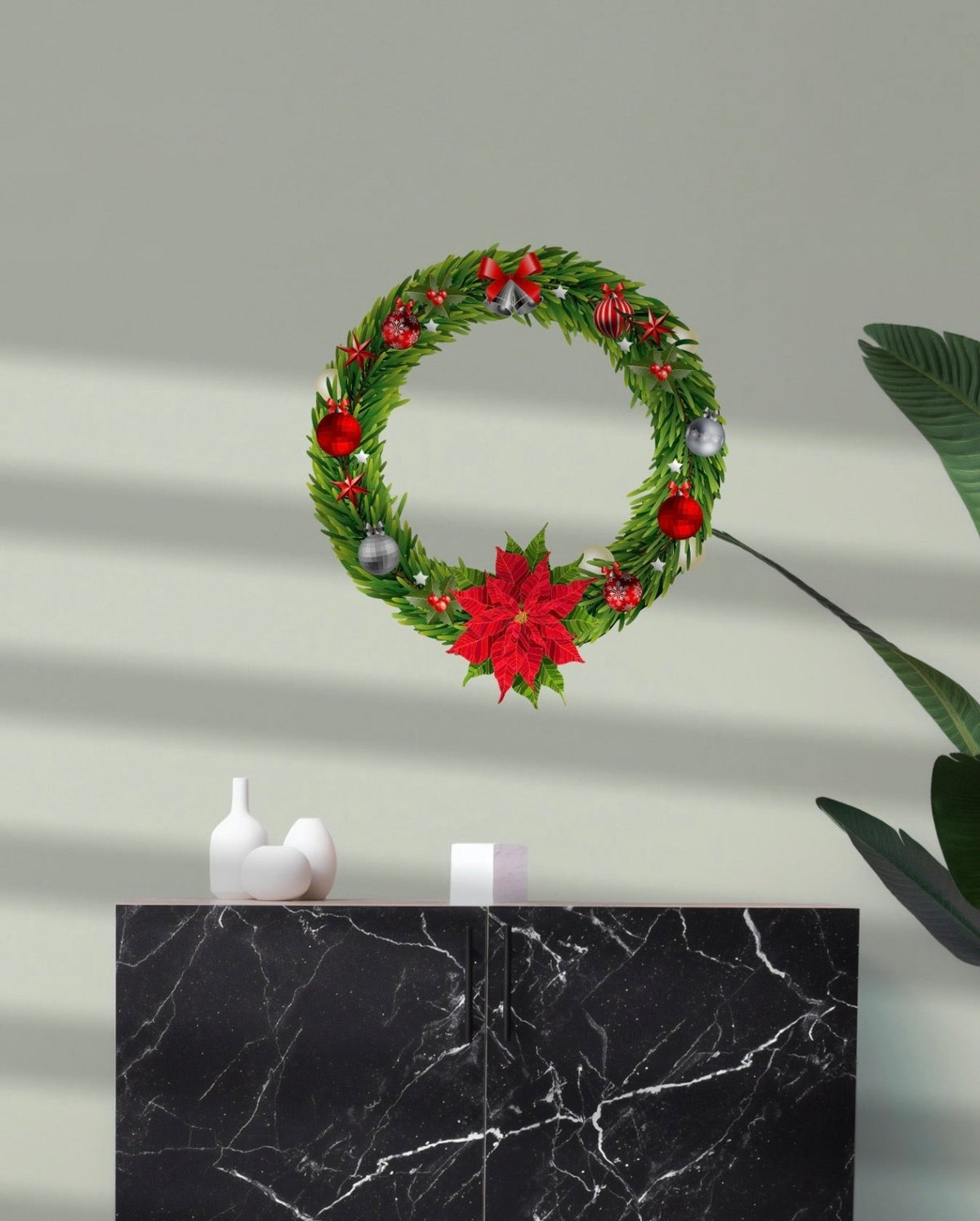 A Cover-Alls Christmas wreath decal with green foliage, red berries, and poinsettias hanging on a gray wall, above a black marble cabinet with two white vases.