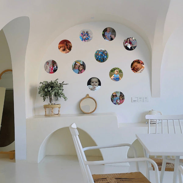 An interior view of a room with white walls and furniture, featuring a rounded alcove decorated with multiple circular Cover-Alls Custom Photo Circle Decals.