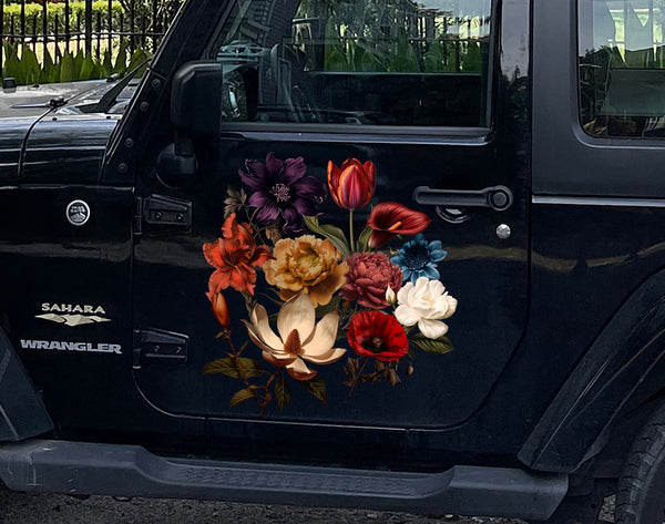 A black Jeep Wrangler Sahara adorned with Cover-Alls' Dark Romance Vintage Flower Decals on the driver’s door, showcasing a variety of colorful flowers.