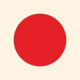 A large, solid red circle centered on a plain light beige background, resembling Cover-Alls Dot Decals.