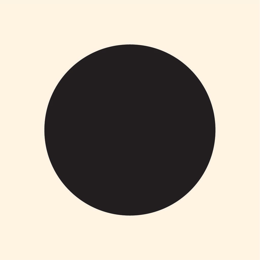 A simple graphic of a large black circle, resembling a Dot Decal from Cover-Alls, centered on a plain beige background.