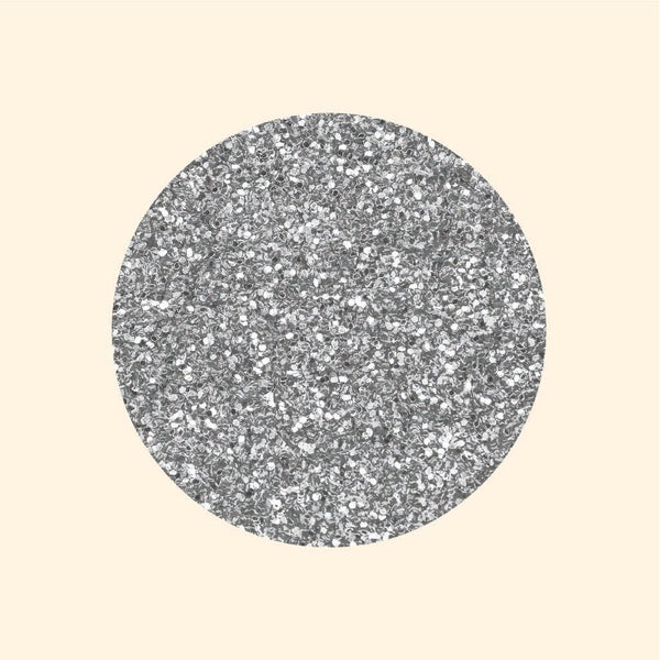 A round glittery silver surface with textured speckles and Cover-Alls Dot Decals on a beige background.