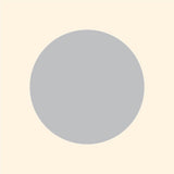 A simple graphic of a large gray circle centered on a light beige background, enhanced with vibrant colors from Cover-Alls Dot Decals.
