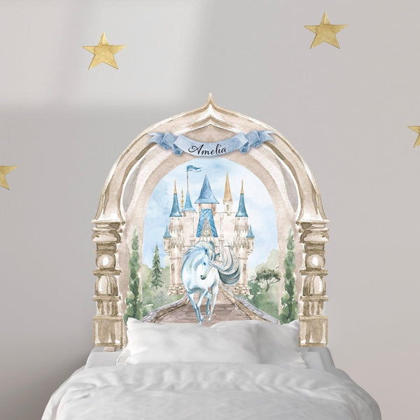 A child's bed with a custom Enchanted Castle with Unicorn Decal headboard by Cover-Alls, surrounded by decorative gold stars on the wall.