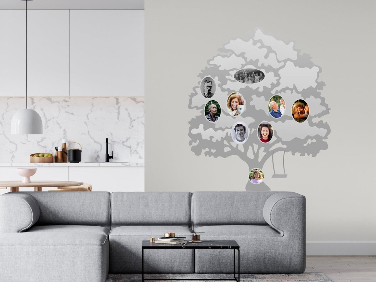 A modern living room with a Cover-Alls Family Tree Wall Decal with Custom Photos featuring diverse people on a light gray wall.