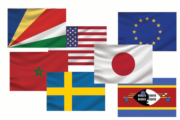 A collection of nine Cover-Alls Flags of the World decals from various countries, displayed overlapping each other on a white background.