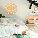 Bright, airy bedroom with a white bed, decorative pillows, a straw hat on the bed, wooden furniture, plants, and Cover-Alls mandala wall decals.