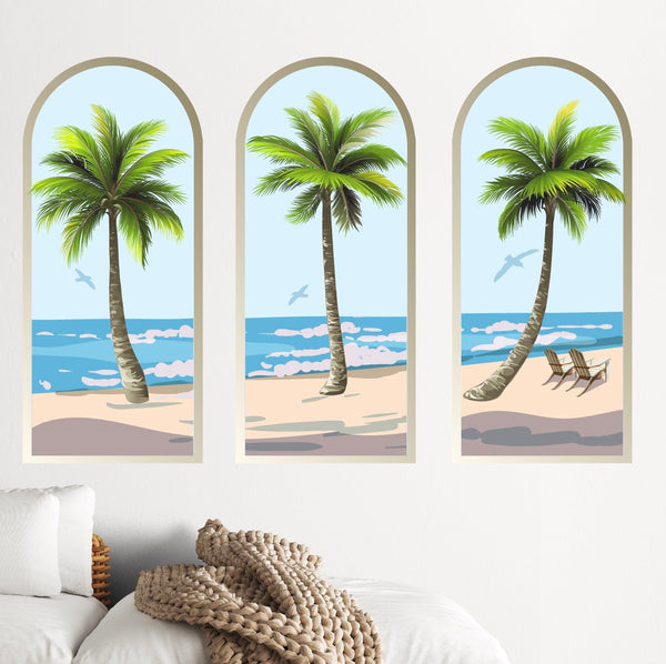 Three vertical wall panels depicting palm trees at a beach, with a clear sky, ocean waves, and a hammock in one panel as calming environment decor. The Palm Tree Arch Scene Decals by Cover-Alls.