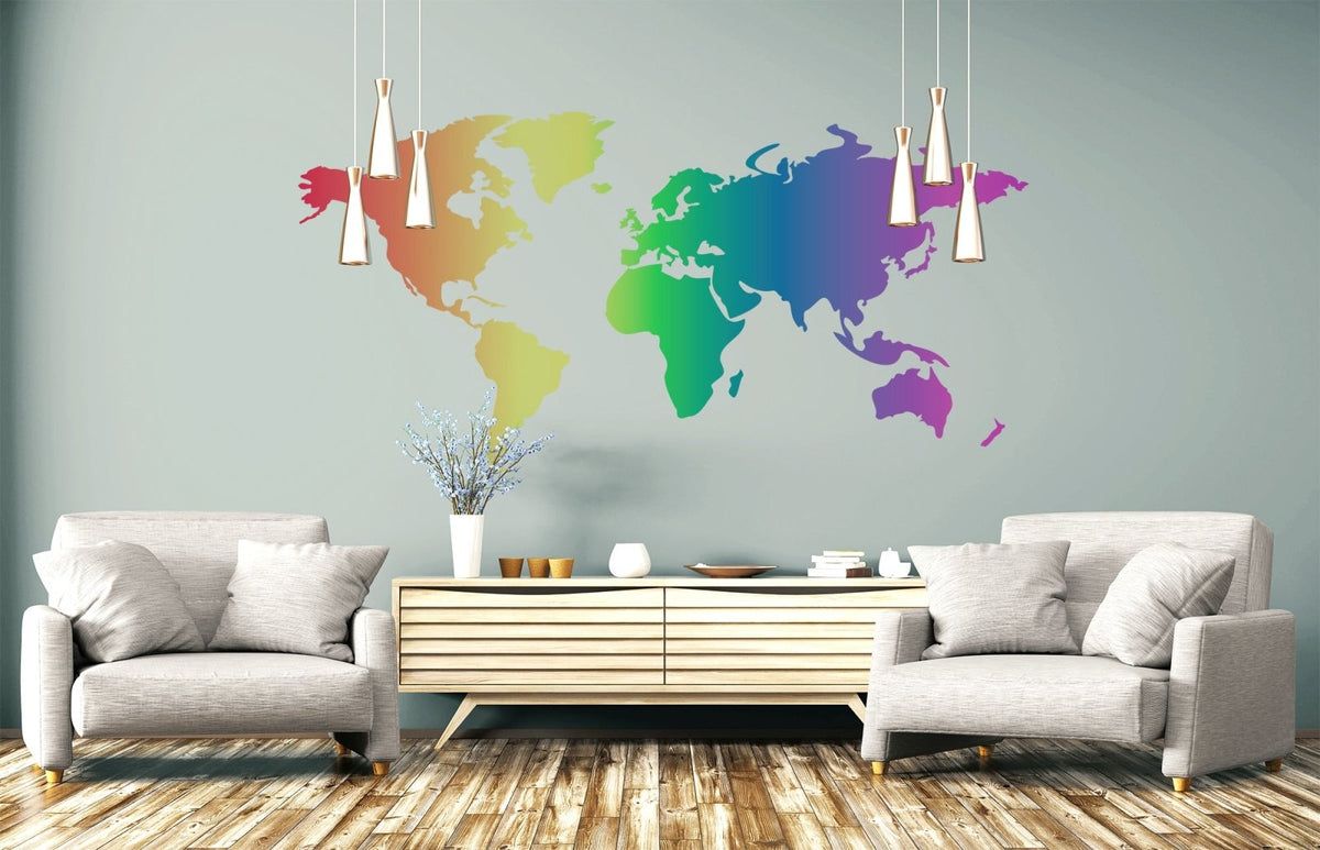 A modern living room with two gray armchairs, a wooden coffee table, and a Cover-Alls Rainbow World Map mural on the wall.
