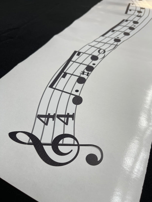 A Custom Musical Line Melody by Cover-Alls, featuring a G clef, two flat symbols, and musical notes in a 4/4 time signature, is elegantly displayed on a white piece of paper.