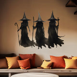 Three figures in dark, wizard-like robes and pointed hats, part of the Cover-Alls' 