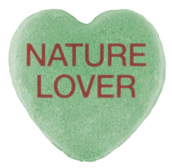 Green heart-shaped Candy Hearts with the words "nature lover" written in red text for Valentine's Day by Cover-Alls.