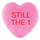 A pink Cover-Alls candy heart with the phrase 
