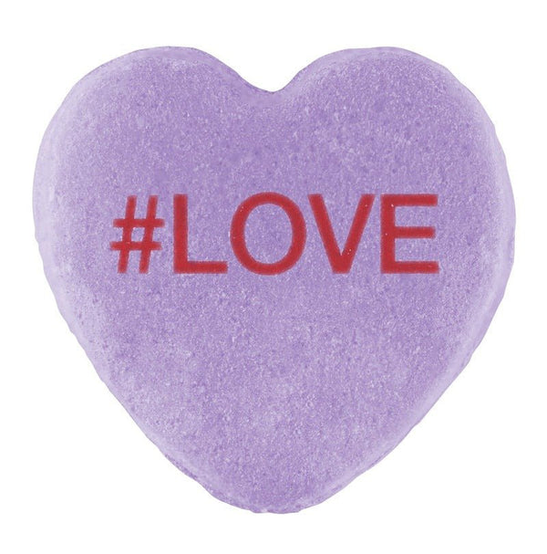 A purple heart-shaped Cover-Alls Candy Heart with the hashtag "#love" in red text.