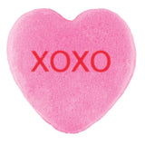A pink heart-shaped candy with 