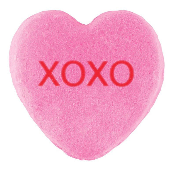 A pink heart-shaped candy with "xoxo" imprinted in red on its surface, perfect for Valentine's Day, Cover-Alls Candy Hearts.