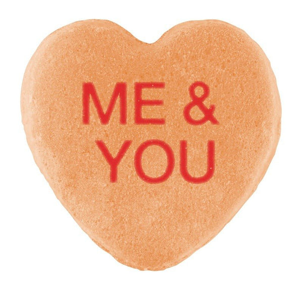 Heart-shaped Candy Hearts with the words "me & you" written in red icing, isolated on a white background for Valentine's Day by Cover-Alls.