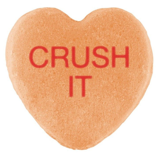 Heart-shaped candy with "crush it" Cover-Alls Candy Hearts embossed in red letters.