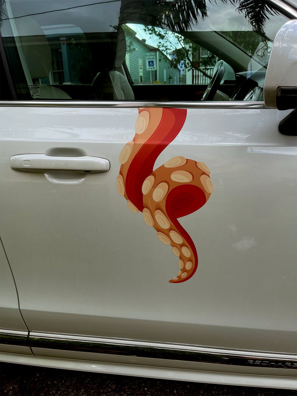 White car with a red and orange Eight Terrifying Tentacle Decal from Cover-Alls on the door.