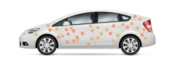 White car with orange and beige Cover-Alls Dot Decals on its body, displayed in profile view on a white background.