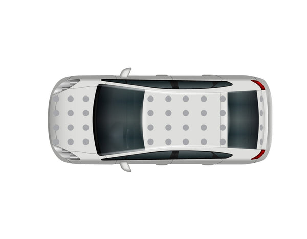 Top-down view of a white sedan with a sunroof and CoverAlls Dot Decals on the hood.