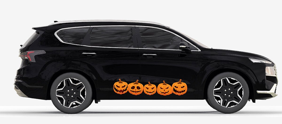 Side view of a black SUV with a row of Cover-Alls Jack O' Lantern Pumpkin Decals along the side, against a plain white background.
