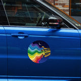 A blue car with a Cover-Alls Jazzy Night Decal featuring a landscape, stars, and trumpets on its door, parked on a city street.