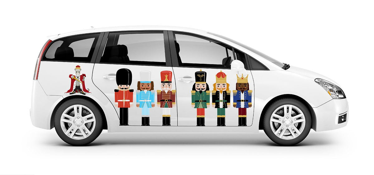 White minivan with a row of colorful Cover-Alls Nutcracker Decals illustrations on the side, isolated on a white background.