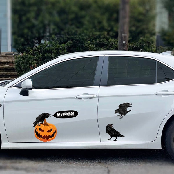 White car decorated with Red-Eyed Ravens and jack o'lantern stickers on the side, parked outdoors, by Cover-Alls.