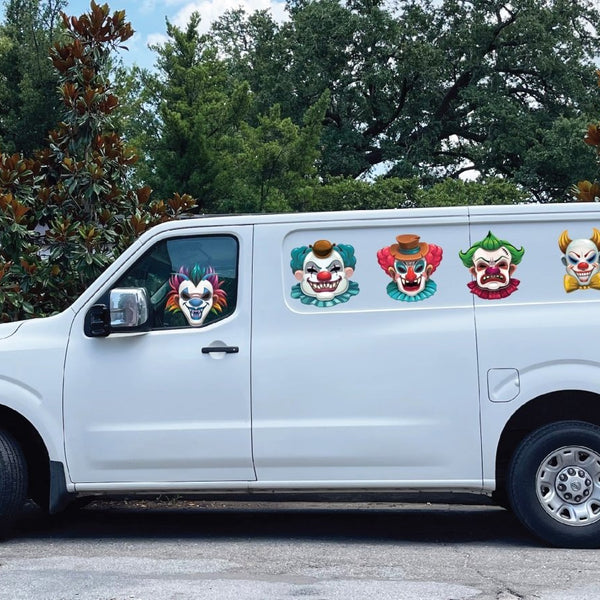 A white van parked on a street with Cover-Alls life-sized, Scary Clowns decals on its side.