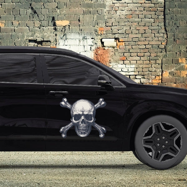 Black SUV with a Cover-Alls Skull & Crossbone Decal on the door parked beside a weathered brick wall.