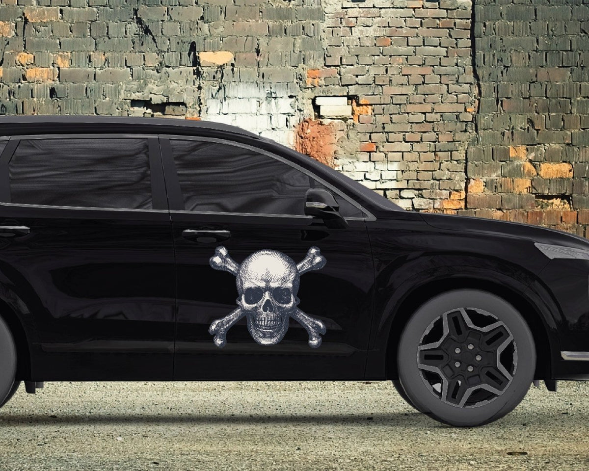 A black SUV with Halloween themed decals of Skull & Crossbones from the brand CoverAlls painted on it.